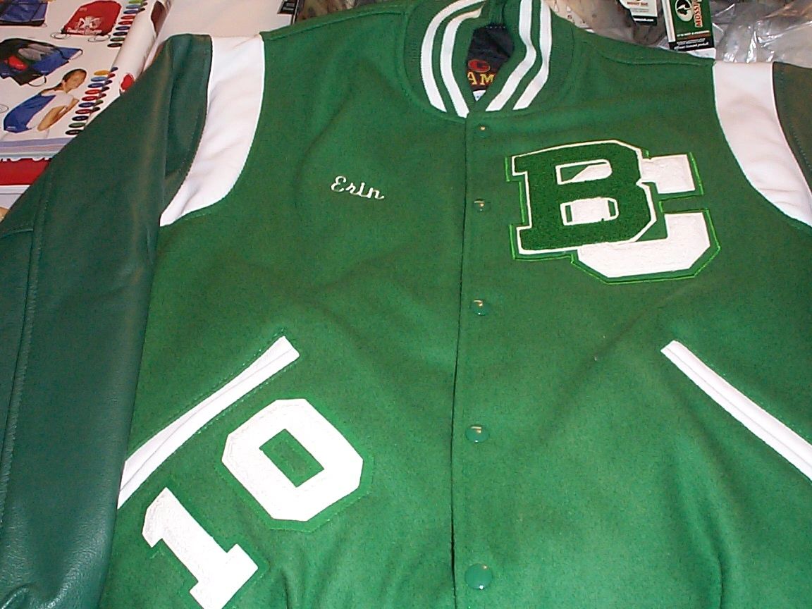 Green varsity jacket with embroidered number 50